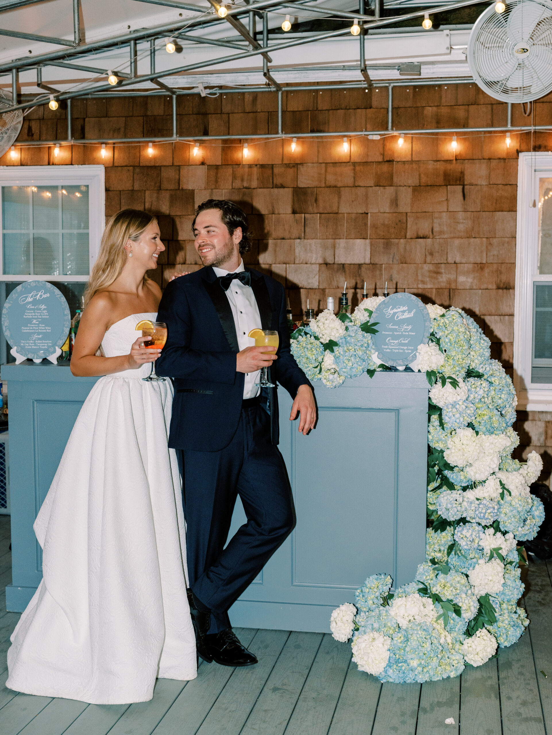 chesapeake bay beach club winter wedding fashion statement gown tail